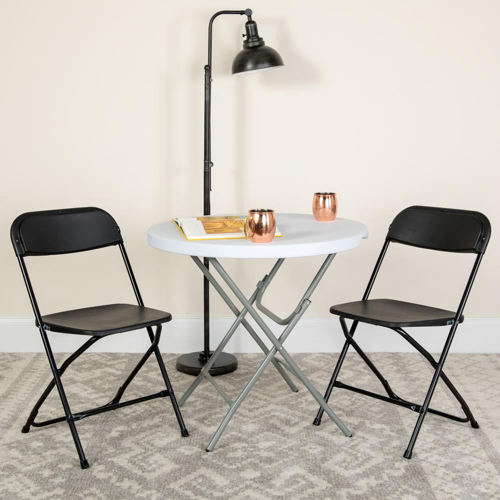 HERCULES Series 650 lb. Capacity Premium Black Plastic Folding Chair - Flash Furniture