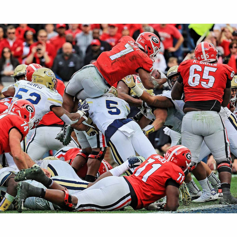 D'Andre Swift Georgia Bulldogs Unsigned Red Jersey Hurdles into Endzone vs. Georgia Tech Photograph